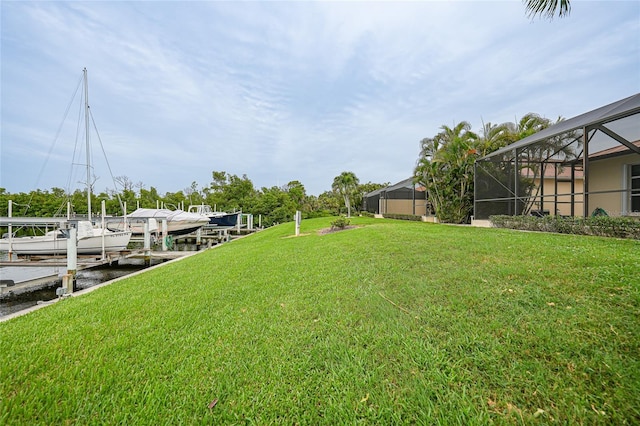 1527 Aqui Esta Dr Unit 3, Punta Gorda, FL 33950 - view of grassy yard featuring a boat dock and a lanai