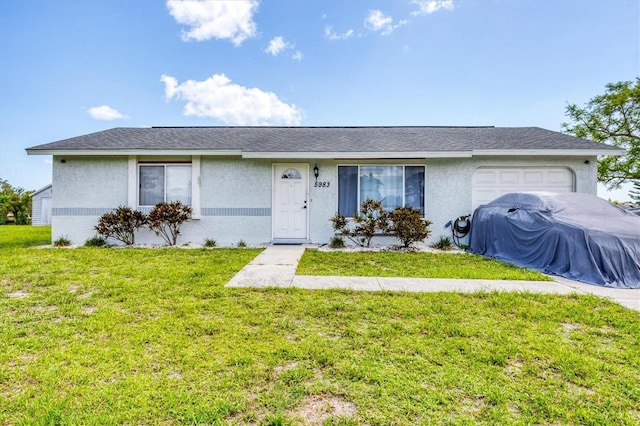 5983 Hobhill Ave, North Port, FL 34287 - single story home with an attached garage, stucco siding, and a front yard
