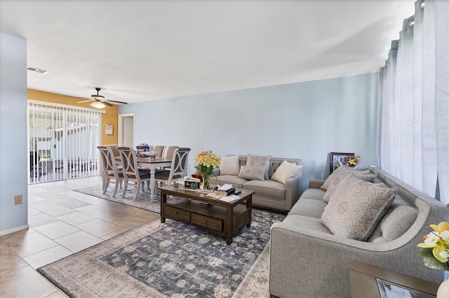 5983 Hobhill Ave, North Port, FL 34287 - living room featuring tile patterned flooring, a ceiling fan, and baseboards