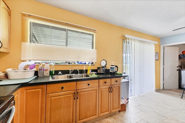 5983 Hobhill Ave, North Port, FL 34287 - kitchen featuring a sink, dark countertops, and range