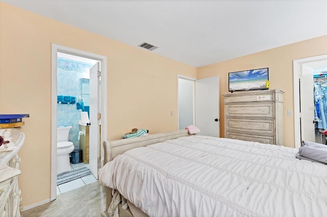 5983 Hobhill Ave, North Port, FL 34287 - bedroom featuring light tile patterned flooring and ensuite bathroom