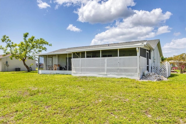 5983 Hobhill Ave, North Port, FL 34287 - back of house with a sunroom, a yard, and cooling unit