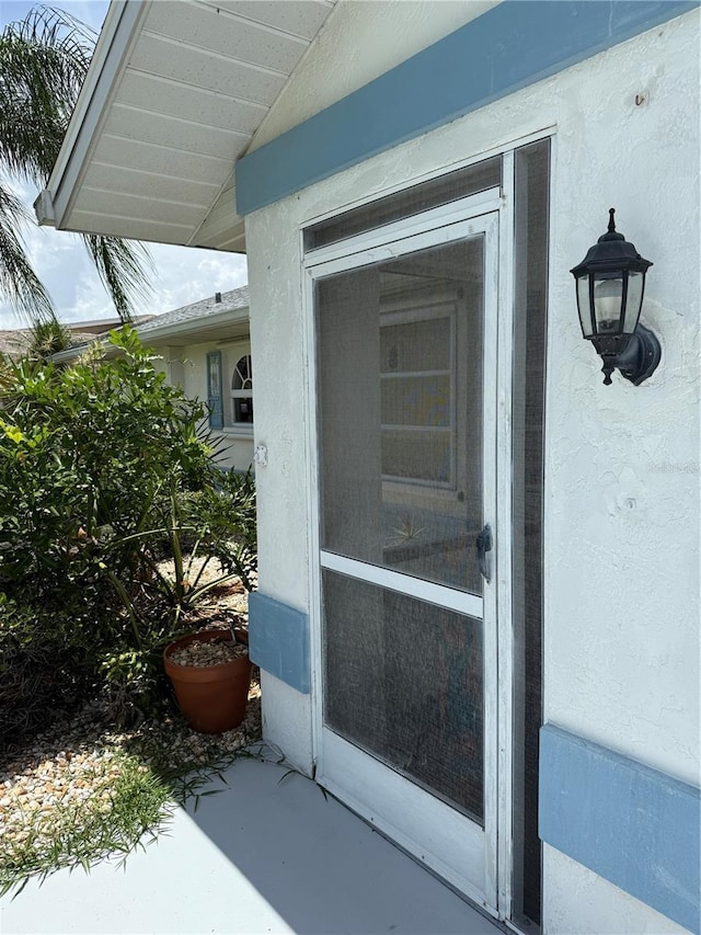 26312 Deep Creek Blvd, Punta Gorda, FL 33983 - doorway to property featuring stucco siding