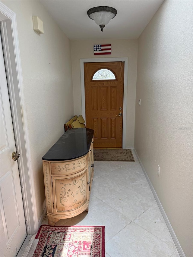 26312 Deep Creek Blvd, Punta Gorda, FL 33983 - doorway to outside with baseboards and light tile patterned floors