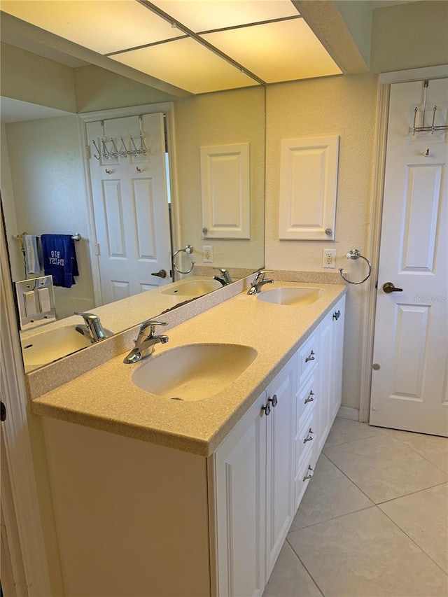 26312 Deep Creek Blvd, Punta Gorda, FL 33983 - bathroom featuring double vanity and tile patterned flooring