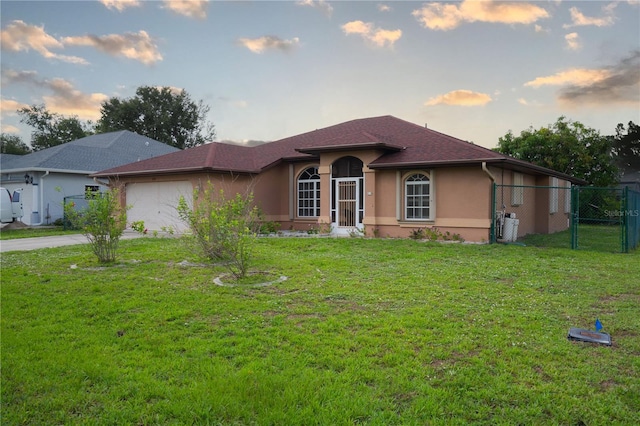 23101 Hillsdale Ave, Port Charlotte, FL 33954 - ranch-style home featuring an attached garage, stucco siding, driveway, and a gate