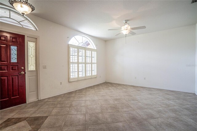 23101 Hillsdale Ave, Port Charlotte, FL 33954 - entryway featuring a ceiling fan and baseboards