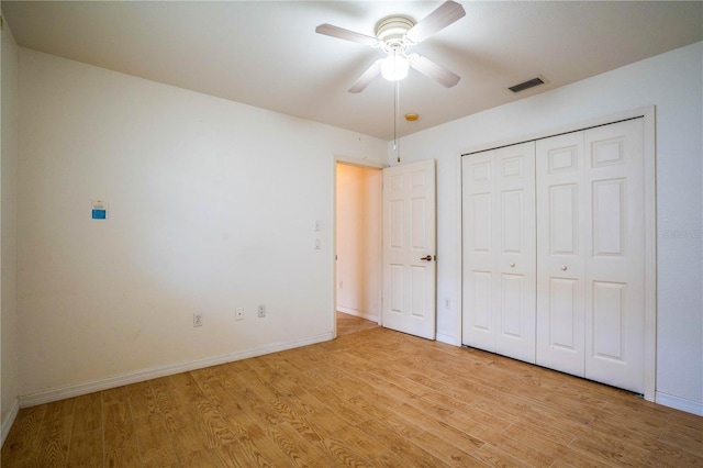 23101 Hillsdale Ave, Port Charlotte, FL 33954 - unfurnished bedroom featuring light wood finished floors, baseboards, a closet, and a ceiling fan