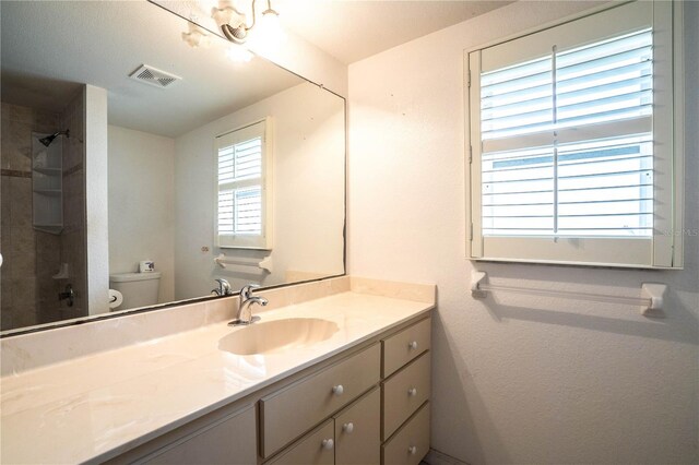 23101 Hillsdale Ave, Port Charlotte, FL 33954 - bathroom featuring toilet, vanity, and a shower