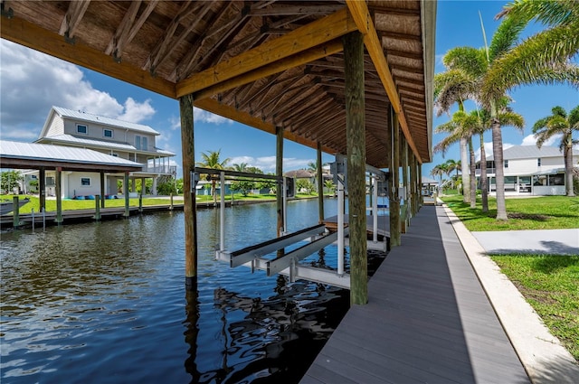 24261 Captain Kidd Blvd, Punta Gorda, FL 33955 - dock featuring boat lift, a water view, and a residential view