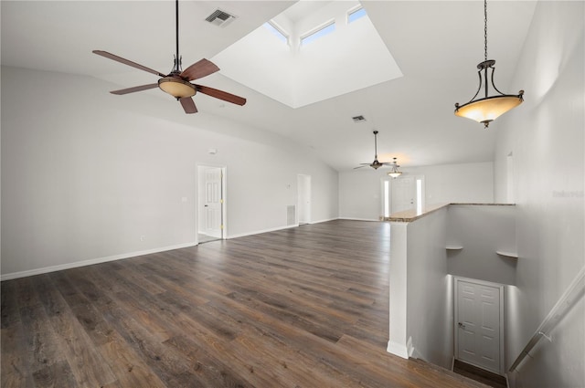 24261 Captain Kidd Blvd, Punta Gorda, FL 33955 - unfurnished living room with a ceiling fan, dark wood-style floors, a skylight, and high vaulted ceiling