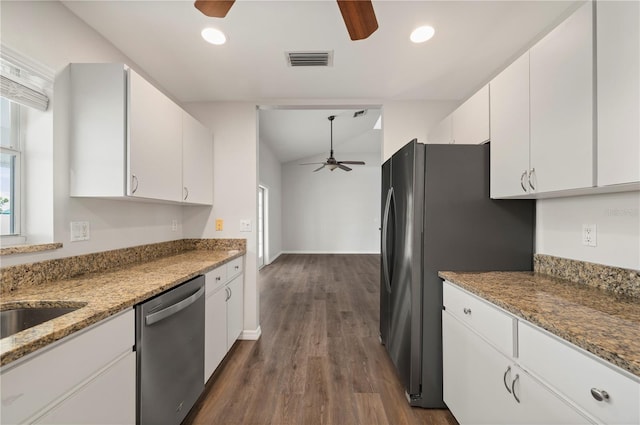 24261 Captain Kidd Blvd, Punta Gorda, FL 33955 - kitchen featuring ceiling fan, appliances with stainless steel finishes, white cabinets, dark wood-type flooring, and light stone counters