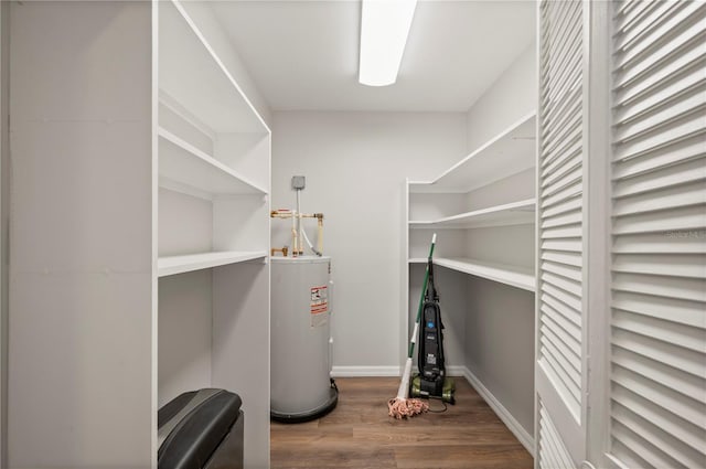 24261 Captain Kidd Blvd, Punta Gorda, FL 33955 - walk in closet featuring water heater and wood finished floors
