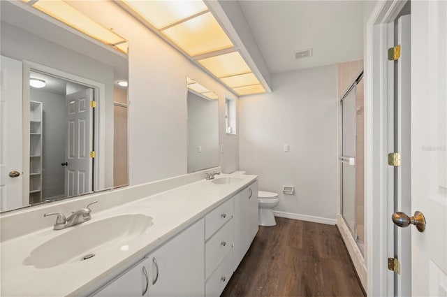 24261 Captain Kidd Blvd, Punta Gorda, FL 33955 - bathroom featuring a stall shower, double vanity, and wood finished floors