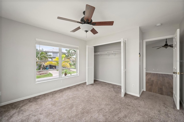 24261 Captain Kidd Blvd, Punta Gorda, FL 33955 - unfurnished bedroom with carpet, a closet, and ceiling fan