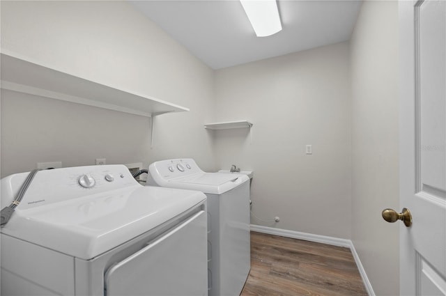 24261 Captain Kidd Blvd, Punta Gorda, FL 33955 - laundry area with washing machine and dryer and wood finished floors