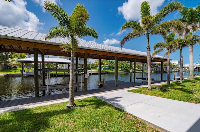 24261 Captain Kidd Blvd, Punta Gorda, FL 33955 - dock featuring boat lift, a water view, and a lawn