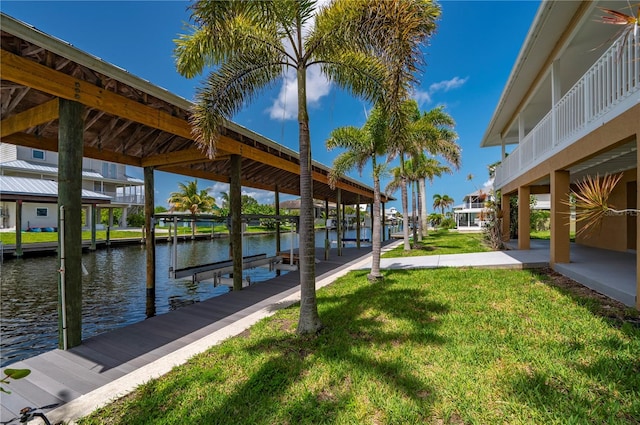 24261 Captain Kidd Blvd, Punta Gorda, FL 33955 - dock with boat lift, a water view, and a yard