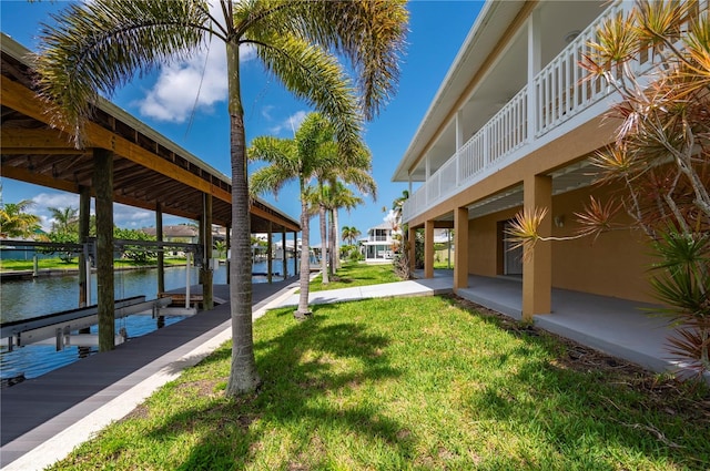 24261 Captain Kidd Blvd, Punta Gorda, FL 33955 - view of grassy yard with boat lift, a dock, and a water view