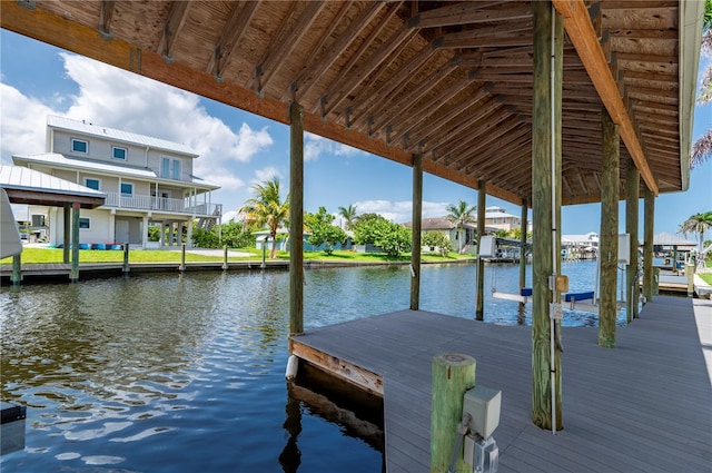 24261 Captain Kidd Blvd, Punta Gorda, FL 33955 - dock area featuring a water view, boat lift, and a residential view