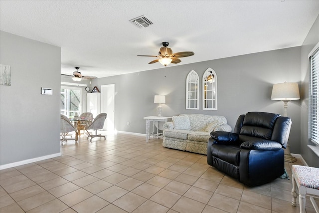 6382 Cutler Ter, Port Charlotte, FL 33981 - living room with a ceiling fan and light tile patterned flooring