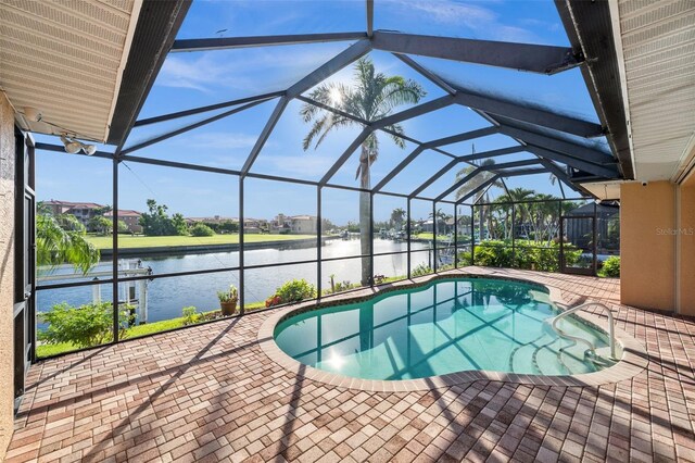 3322 Sandpiper Dr, Punta Gorda, FL 33950 - outdoor pool featuring a patio, a water view, and glass enclosure