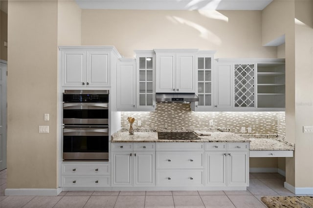 3322 Sandpiper Dr, Punta Gorda, FL 33950 - kitchen featuring double oven, black electric cooktop, under cabinet range hood, and backsplash