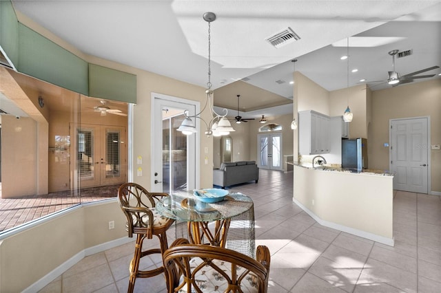 3322 Sandpiper Dr, Punta Gorda, FL 33950 - dining area with ceiling fan, light tile patterned floors, and a high ceiling
