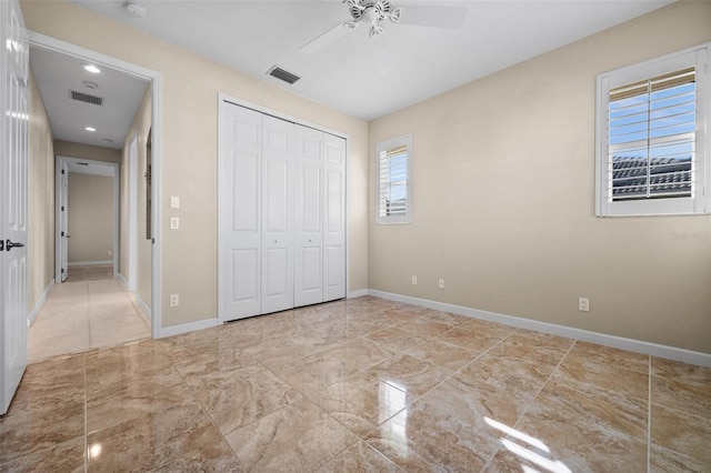 3322 Sandpiper Dr, Punta Gorda, FL 33950 - unfurnished bedroom with a closet, a ceiling fan, recessed lighting, and marble finish flooring