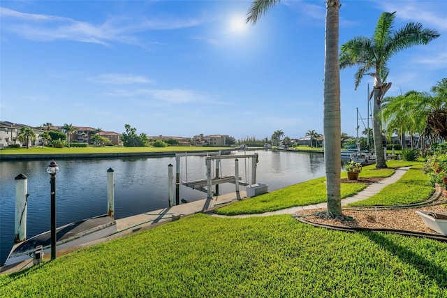 3322 Sandpiper Dr, Punta Gorda, FL 33950 - dock area featuring boat lift, a lawn, a water view, and a residential view