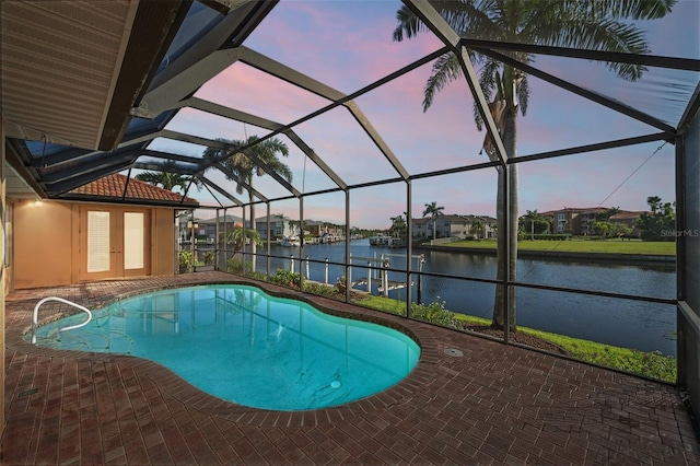 3322 Sandpiper Dr, Punta Gorda, FL 33950 - swimming pool with a patio, a water view, glass enclosure, and french doors