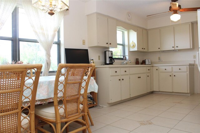 2467 Herron Ter, Port Charlotte, FL 33981 - kitchen with light countertops, ceiling fan, and light tile patterned floors