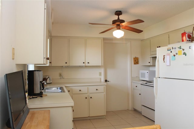 2467 Herron Ter, Port Charlotte, FL 33981 - kitchen featuring white appliances, light countertops, a ceiling fan, light tile patterned floors, and cream cabinets