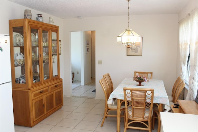 2467 Herron Ter, Port Charlotte, FL 33981 - dining space featuring a chandelier and light tile patterned floors