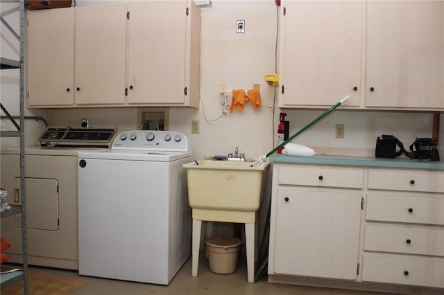 2467 Herron Ter, Port Charlotte, FL 33981 - washroom featuring washing machine and dryer and cabinet space