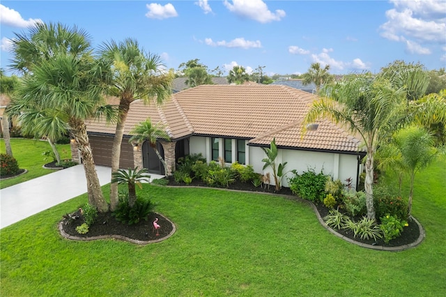 1141 Paraclete Rd, Punta Gorda, FL 33983 - view of front facade with a tile roof, stucco siding, concrete driveway, and a front lawn