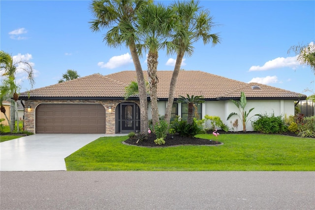 1141 Paraclete Rd, Punta Gorda, FL 33983 - mediterranean / spanish home with an attached garage, stucco siding, concrete driveway, a front yard, and a tile roof