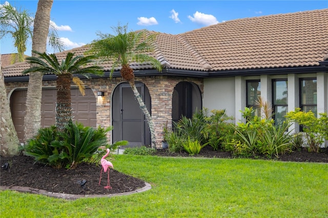 1141 Paraclete Rd, Punta Gorda, FL 33983 - view of front of property with a front lawn, stucco siding, a garage, and a tiled roof