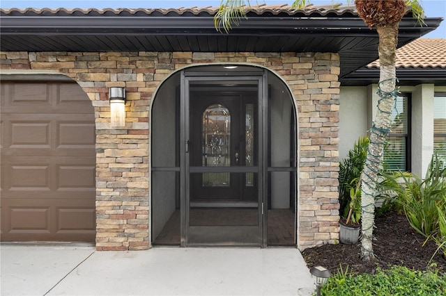 1141 Paraclete Rd, Punta Gorda, FL 33983 - entrance to property with a tile roof, stucco siding, and a garage