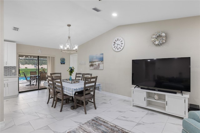 1141 Paraclete Rd, Punta Gorda, FL 33983 - dining area with light marble finish flooring, vaulted ceiling, a chandelier, and recessed lighting