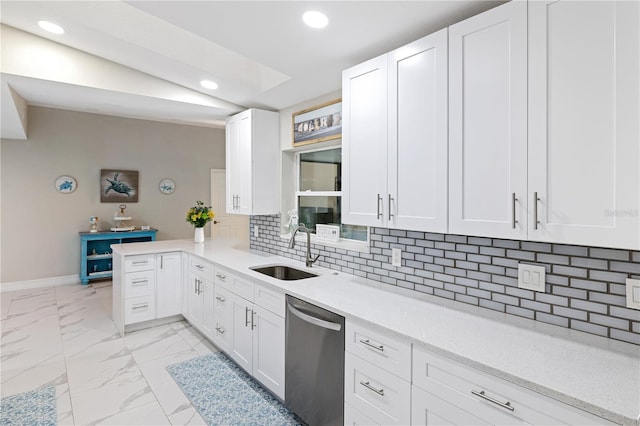 1141 Paraclete Rd, Punta Gorda, FL 33983 - kitchen featuring stainless steel dishwasher, recessed lighting, a peninsula, backsplash, and white cabinets