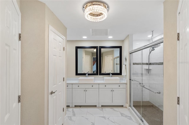 1141 Paraclete Rd, Punta Gorda, FL 33983 - full bathroom with a shower stall, double vanity, marble finish floors, recessed lighting, and a chandelier