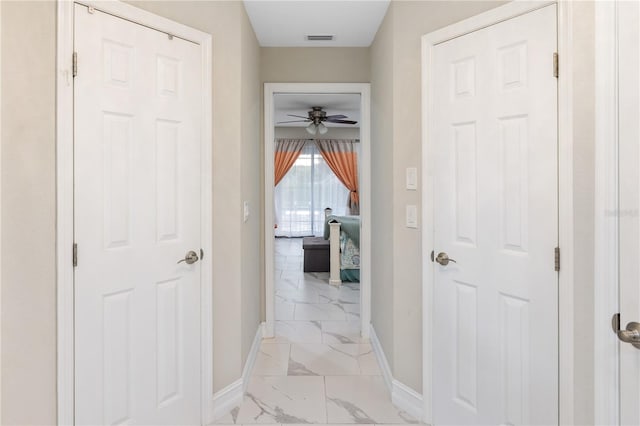 1141 Paraclete Rd, Punta Gorda, FL 33983 - corridor with light marble finish flooring and baseboards