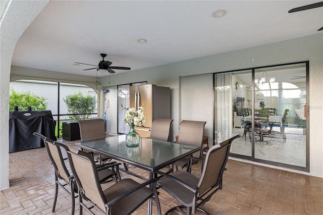 1141 Paraclete Rd, Punta Gorda, FL 33983 - dining room with a ceiling fan, brick patterned floors, and plenty of natural light