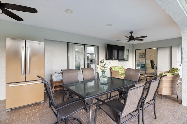 1141 Paraclete Rd, Punta Gorda, FL 33983 - dining space featuring a ceiling fan, brick patterned flooring, and arched walkways