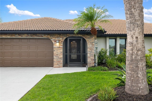 1141 Paraclete Rd, Punta Gorda, FL 33983 - view of front of home with stucco siding, a tile roof, driveway, stone siding, and a garage