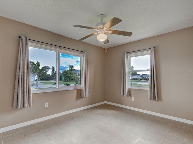 6483 Fabian Rd, North Port, FL 34287 - empty room featuring ceiling fan, a textured ceiling, and light tile patterned floors
