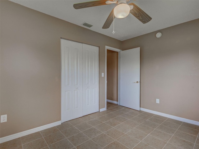 6483 Fabian Rd, North Port, FL 34287 - unfurnished bedroom with a closet, light tile patterned flooring, and a ceiling fan