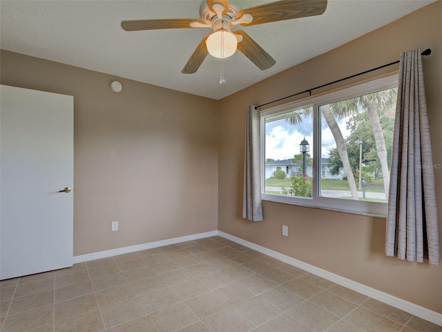 6483 Fabian Rd, North Port, FL 34287 - unfurnished room featuring light tile patterned floors and a ceiling fan