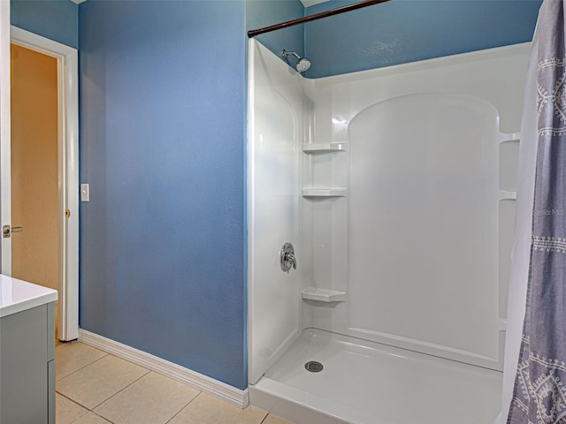 6483 Fabian Rd, North Port, FL 34287 - bathroom with tile patterned floors, a shower with shower curtain, and vanity